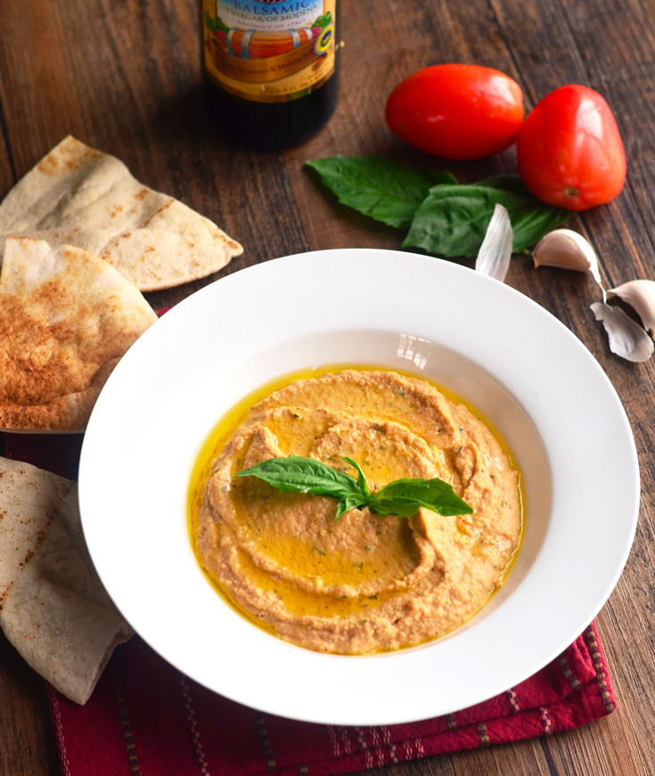 Italian Hummus with roasted tomatoes, garlic and basil is one of the BEST ways to eat hummus + Free Hummus Recipe eBook - The Spice Kit Recipes